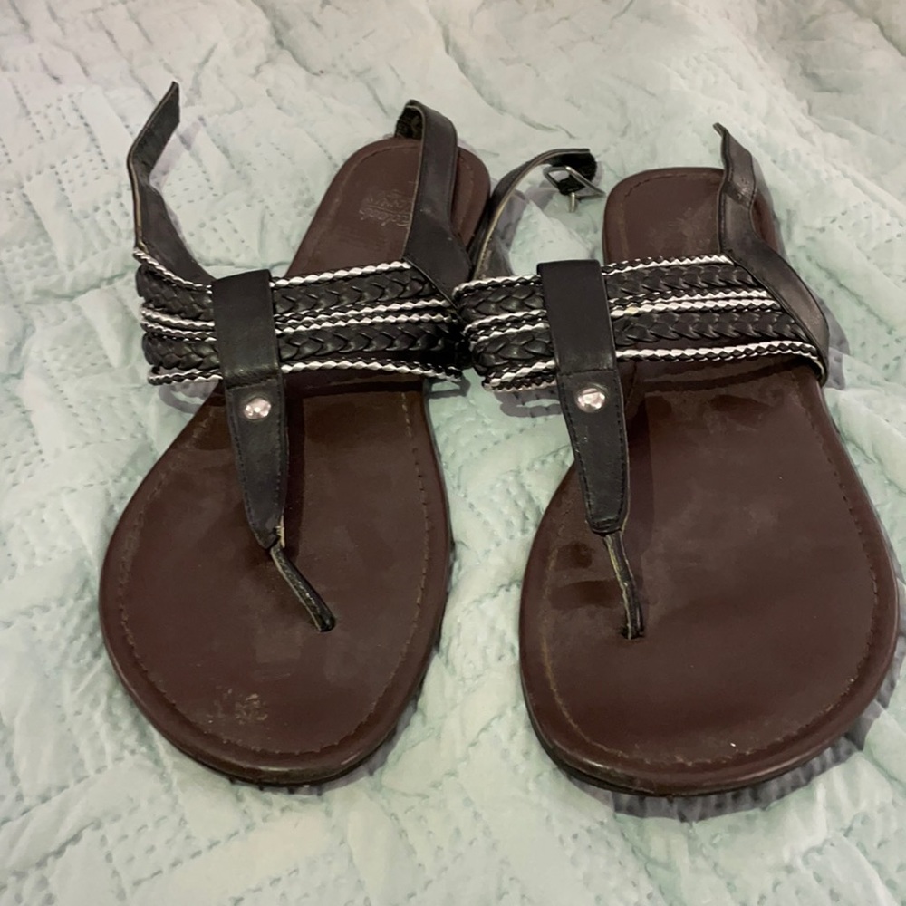 Black and silver thong sandal with wrap around ankle